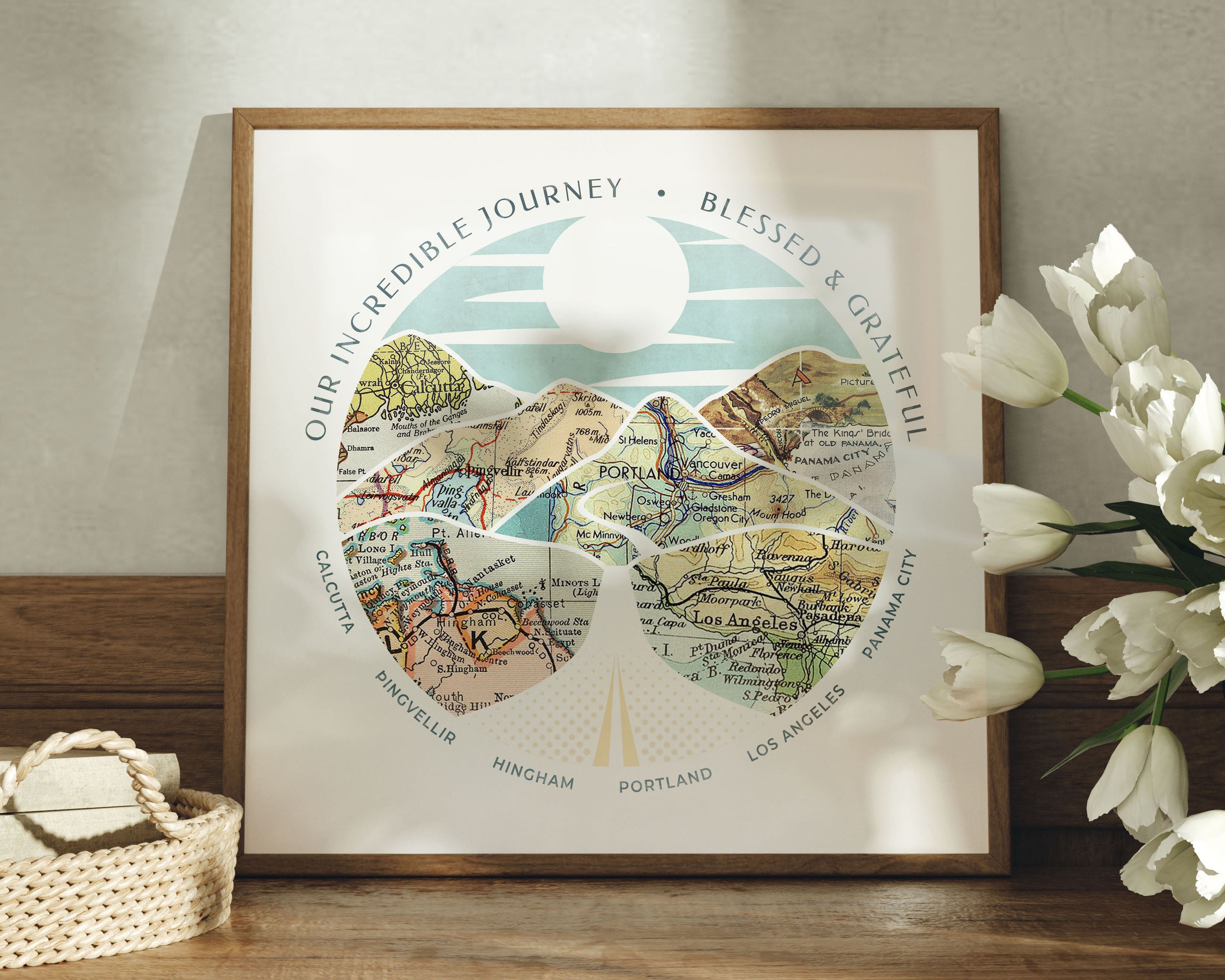 Relief of hills and highway into the horizon, with inset maps. Flowers in the foreground.