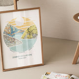 A riverscape with hills with inset maps. Leaning against chair