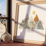 Mountain shaped relief with insert maps. Next to a vase with light from window.