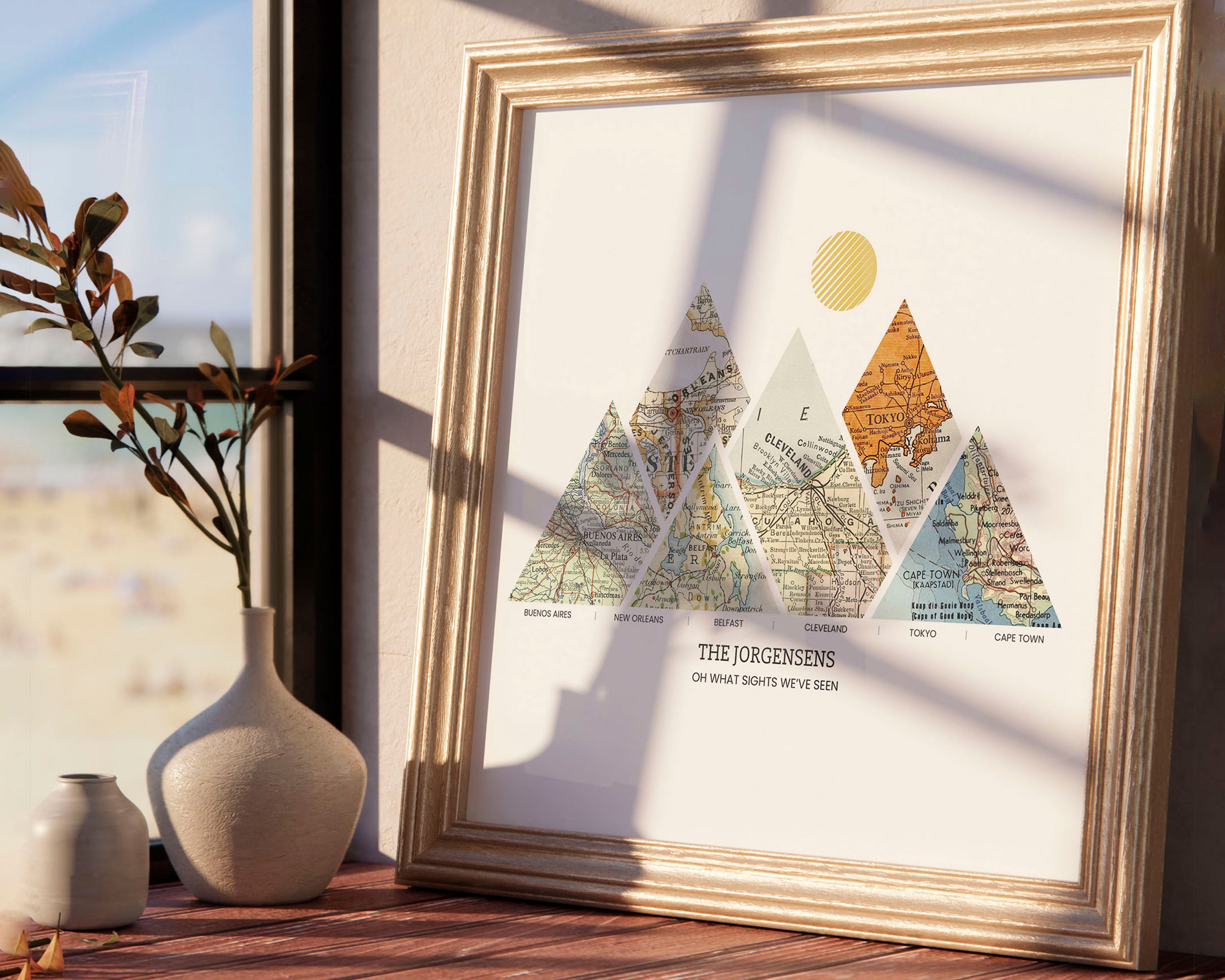Mountain shaped relief with insert maps. Next to a vase with light from window.