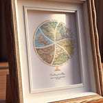 Globe and stand relief design with inset maps. Custom frame on table.