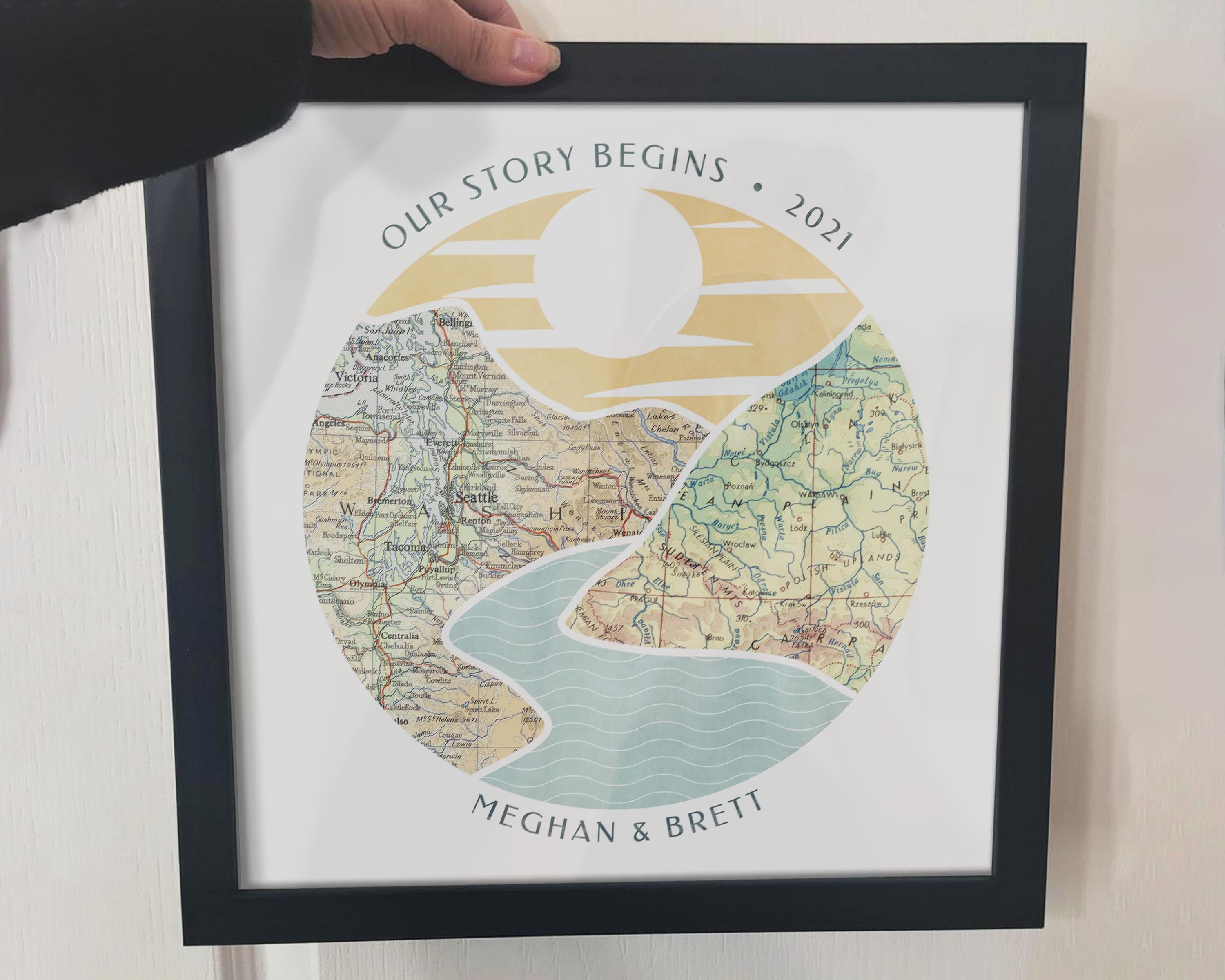 [Black Frame|12x12|2 Maps] River scape relief with inset maps in hills. Woman's arm holding frame.