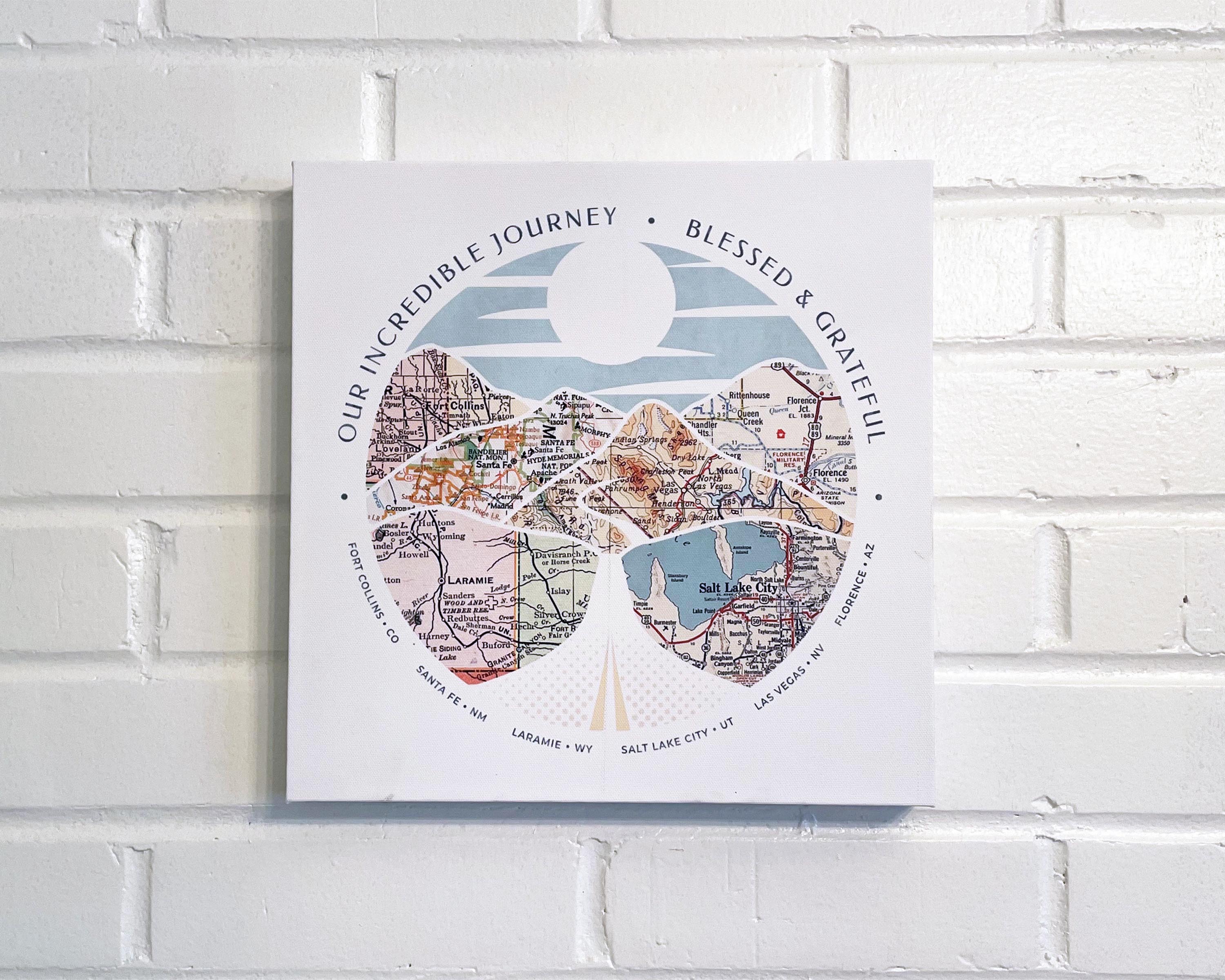 [Canvas Wrap|12x12|6 Maps] Relief of hills and highway into the horizon, with inset maps. On a white brick wall.