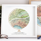 Terra Carta™ Map Print with two maps, resting on a nightstand next to another artwork, a succulent, and a pair of glasses