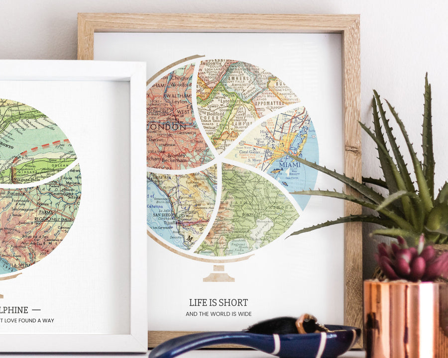 Terra Carta™ Map Print with five maps, leaning against a wall with other art, and an aloe plant in a copper planter