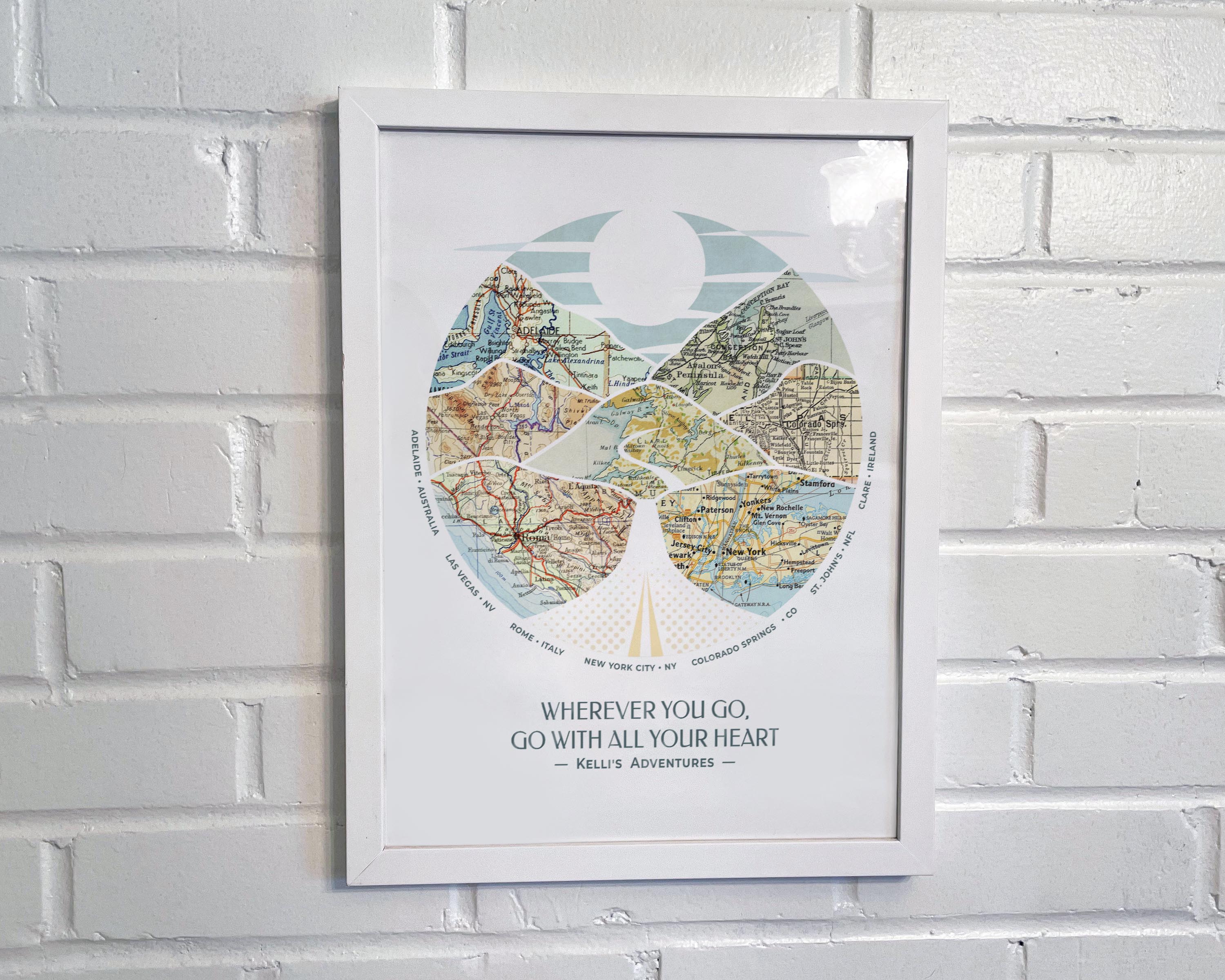 [White Frame|12x16|7 Maps] Relief of hills and highway into the horizon, with inset maps. On white brick wall