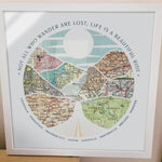 [White Frame|16x16|8 Maps] Relief of hills and highway into the horizon, with inset maps. Sitting on a table.