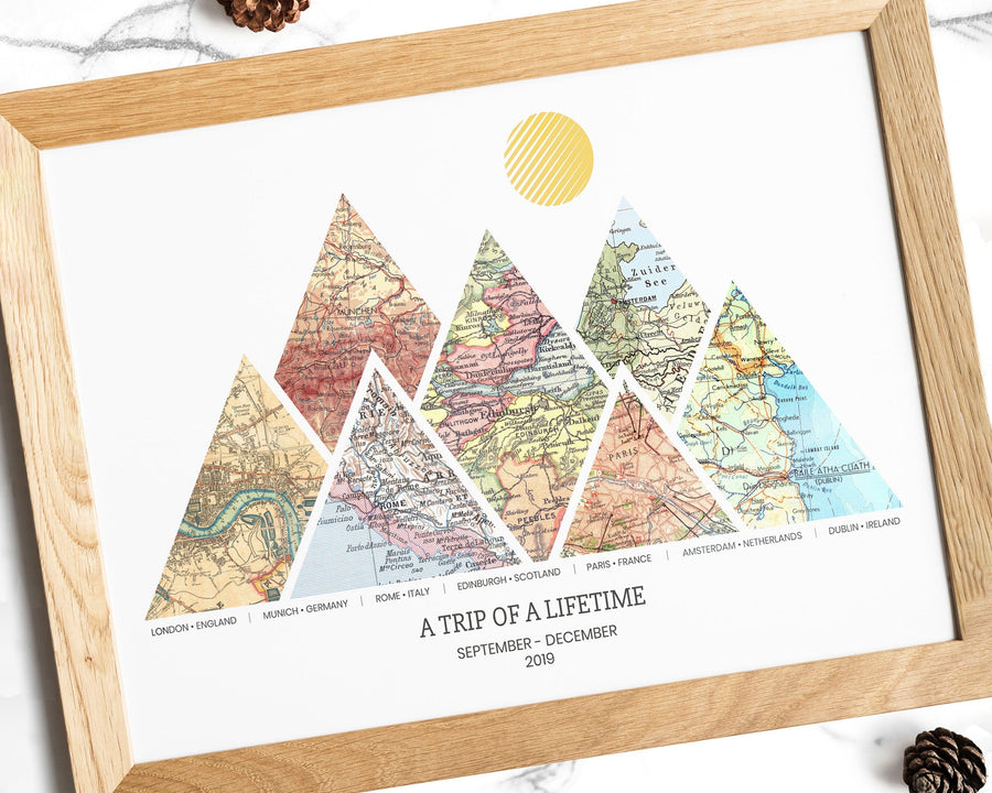 A personalized adventure map print with seven triangular vintage map sections in wooden frame