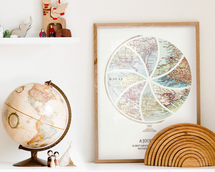Terra Carta™ Map Print with eight maps, next to a vintage globe