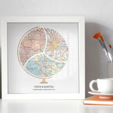 Terra Carta™ Map Print with three maps, sitting on a desk next to a vase, cup full of paint brushes, and a teacup resting on a notebook