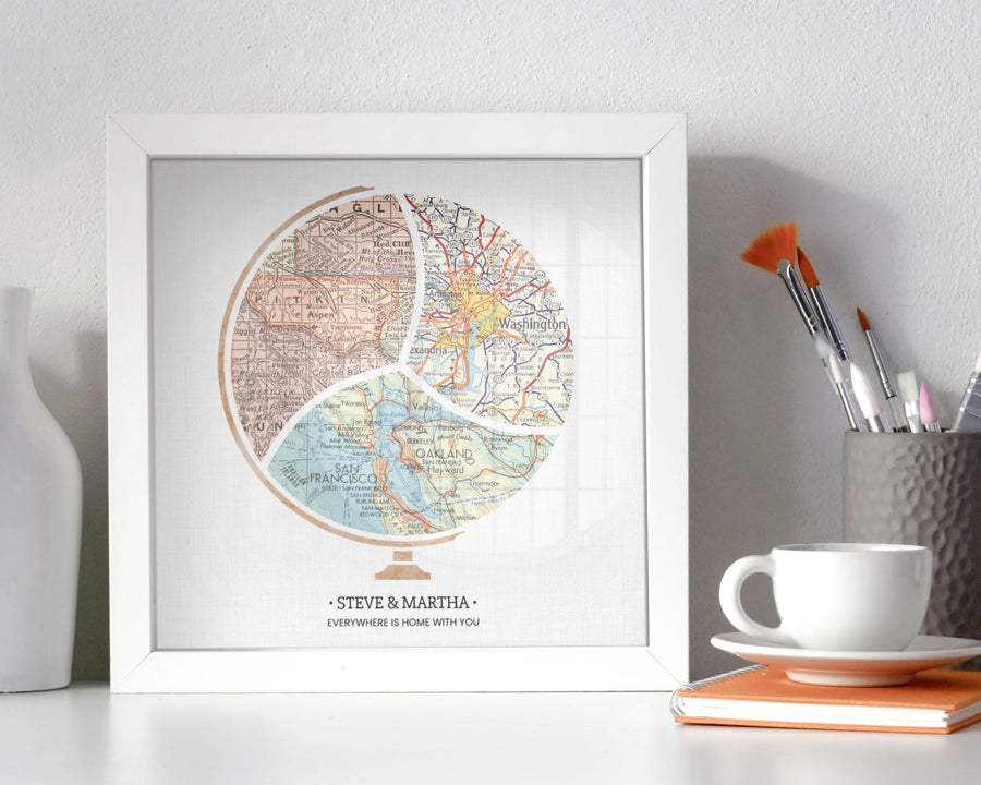 Terra Carta™ Map Print with three maps, sitting on a desk next to a vase, cup full of paint brushes, and a teacup resting on a notebook
