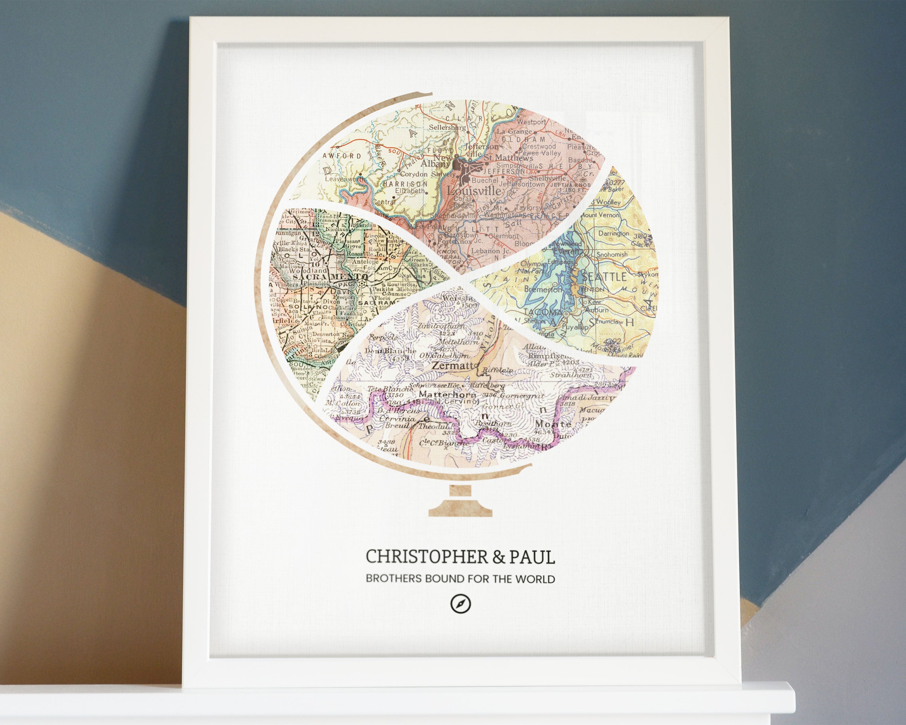 Terra Carta™ Map Print with four maps, resting on a mantle, leaning against a colorfully painted wall, 