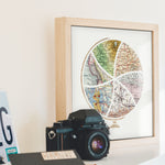 Terra Carta™ Map Print with six maps, sitting on a mantle next to a vintage camera