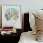 wanderlust roadtrip map print four maps white frame. Relief of hills and highway into the horizon, with inset maps. Sitting on bedside counter